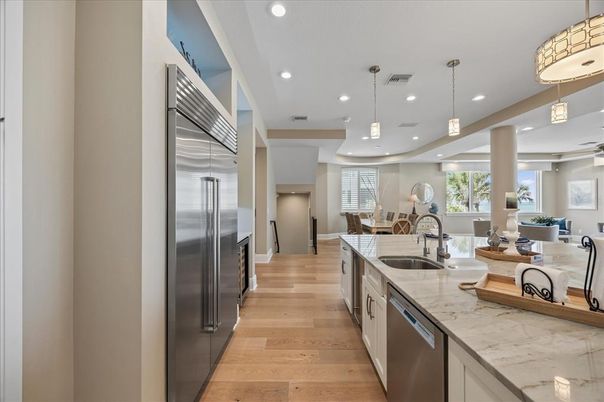 Dining room, Interior, Kitchen, Pendant Lights, Recessed Lighting, Stainless Steel Appliances, Wood Texture Flooring
