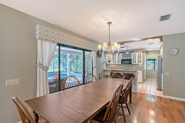 Chandelier, Dining room, Fireplace, Interior, Recessed Lighting, Wood Texture Flooring