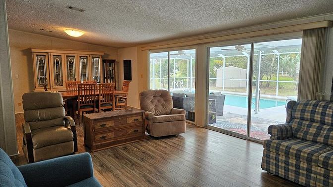 Dining room, Interior, Pool, Sun Room, Wood Texture Flooring