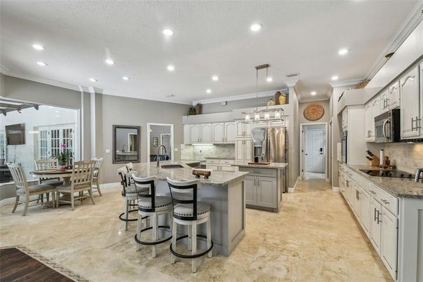 Chandelier, Dining room, Interior, Kitchen, Pendant Lights, Recessed Lighting, Stainless Steel Appliances