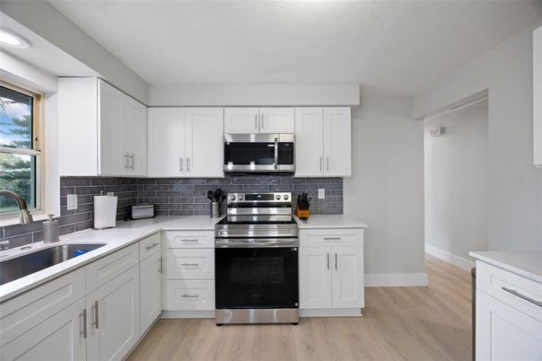 Interior, Kitchen, Recessed Lighting, Stainless Steel Appliances, Wood Texture Flooring