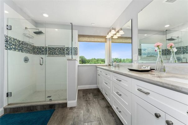 Bathroom, Dual Sink Vanities, Glass Shower, Interior, Recessed Lighting, Wood Texture Flooring