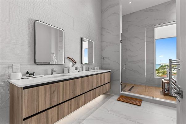 Bathroom, Dual Sink Vanities, Glass Shower, Interior, Marble, Marble Walls, Recessed Lighting