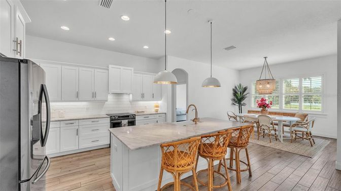 Dining room, Interior, Kitchen, Pendant Lights, Recessed Lighting, Stainless Steel Appliances, Wood Texture Flooring