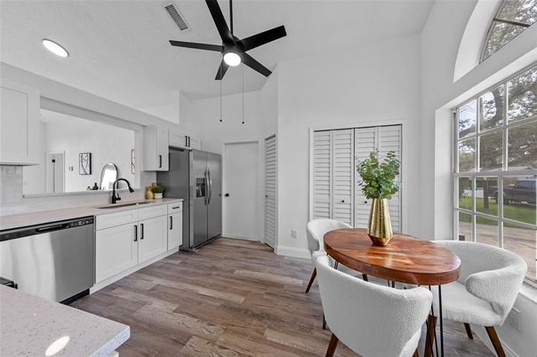 Dining room, Interior, Kitchen, Recessed Lighting, Stainless Steel Appliances, Wood Texture Flooring