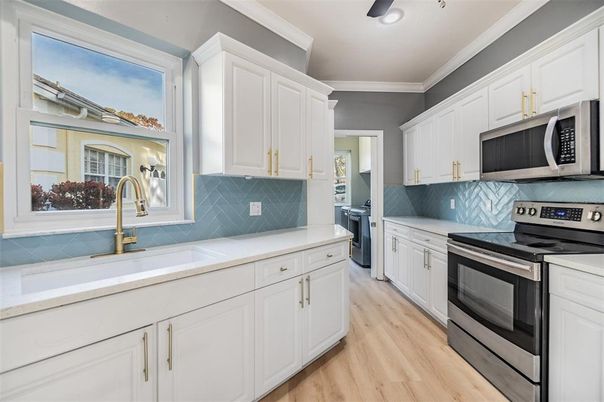 Interior, Kitchen, Recessed Lighting, Stainless Steel Appliances, Washer, Wood Texture Flooring
