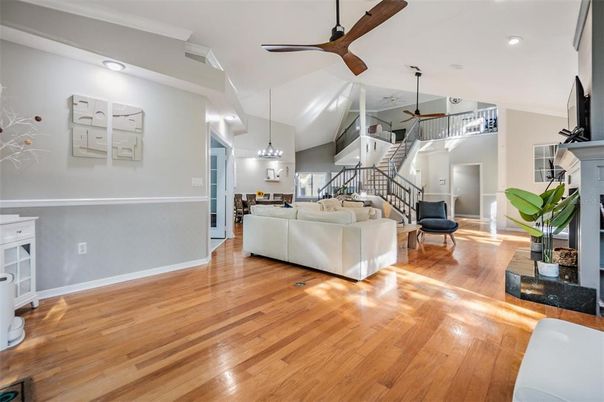 Chandelier, Fireplace, Interior, Living room, Pendant Lights, Recessed Lighting, Wood Texture Flooring