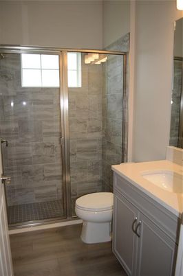 Bathroom, Glass Shower, Interior, Marble Walls, Wood Texture Flooring