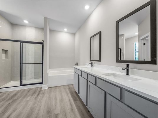 Bathroom, Dual Sink Vanities, Glass Shower, Interior, Recessed Lighting, Wood Texture Flooring