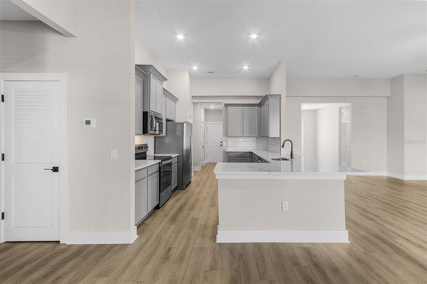 Interior, Kitchen, Recessed Lighting, Stainless Steel Appliances, Wood Texture Flooring