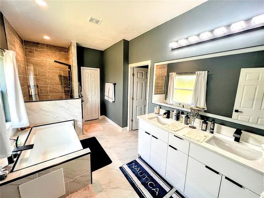 Bathroom, Dual Sink Vanities, Glass Shower, Interior, Marble, Marble Walls, Recessed Lighting