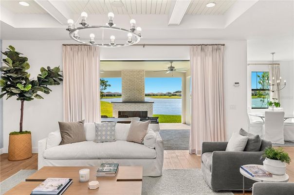 Chandelier, Dining room, Fireplace, Interior, Living room, Recessed Lighting, Water, Wood Texture Flooring