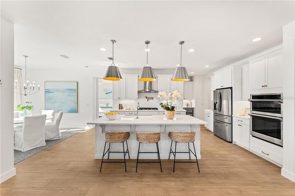 Dining room, Interior, Kitchen, Pendant Lights, Recessed Lighting, Stainless Steel Appliances, Wood Texture Flooring