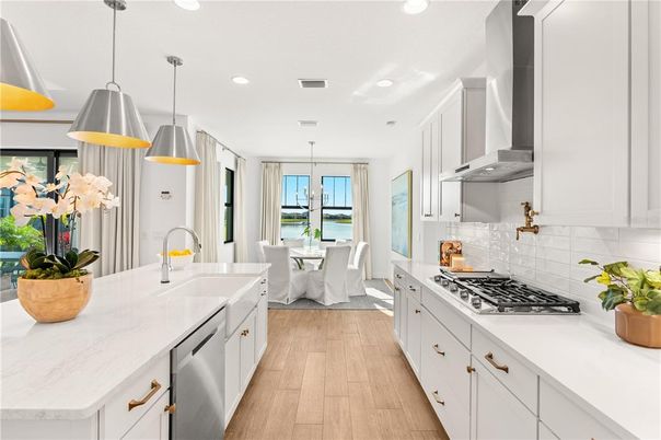 Dining room, Interior, Kitchen, Pendant Lights, Recessed Lighting, Stainless Steel Appliances, Water, Wood Texture Flooring