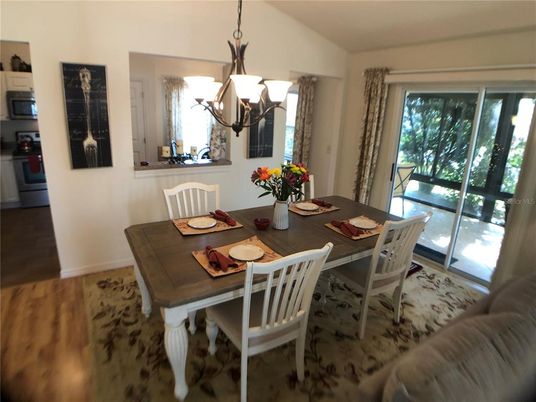Chandelier, Dining room, Interior, Wood Texture Flooring