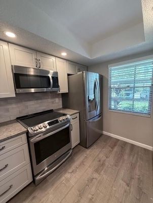 Interior, Kitchen, Recessed Lighting, Stainless Steel Appliances, Wood Texture Flooring