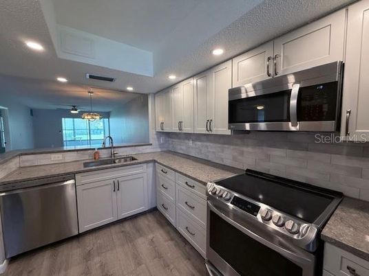 Interior, Kitchen, Pendant Lights, Recessed Lighting, Stainless Steel Appliances, Wood Texture Flooring
