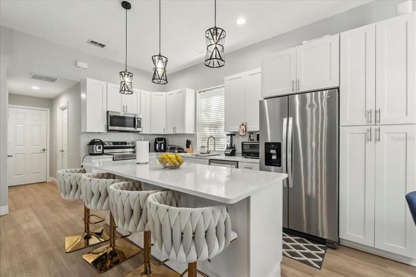 Interior, Kitchen, Pendant Lights, Recessed Lighting, Stainless Steel Appliances, Wood Texture Flooring