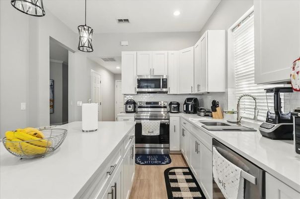 Interior, Kitchen, Pendant Lights, Recessed Lighting, Stainless Steel Appliances, Wood Texture Flooring