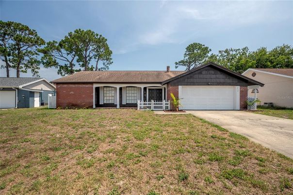 Attached, Backyard, Exterior, Facade, Brick Facade, Ranch