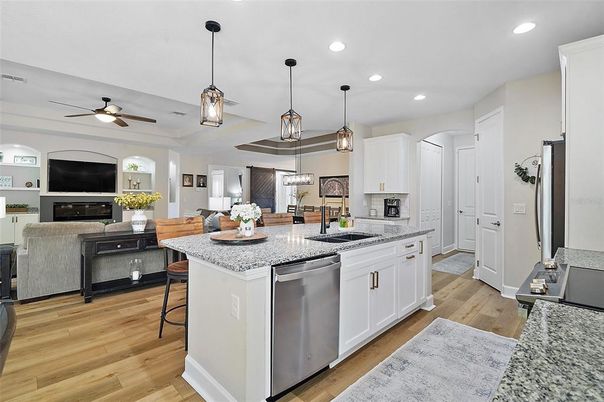 Fireplace, Interior, Kitchen, Pendant Lights, Recessed Lighting, Stainless Steel Appliances, Wood Texture Flooring