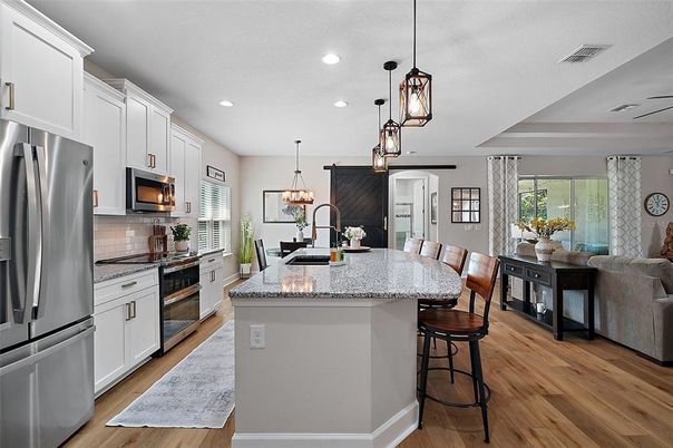 Dining room, Interior, Kitchen, Pendant Lights, Recessed Lighting, Stainless Steel Appliances, Wood Texture Flooring