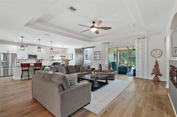Fireplace, Interior, Kitchen, Living room, Pendant Lights, Recessed Lighting, Stainless Steel Appliances, Wood Texture Flooring