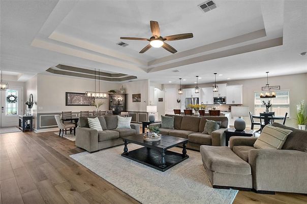 Chandelier, Dining room, Interior, Kitchen, Living room, Pendant Lights, Recessed Lighting, Stainless Steel Appliances, Wood Texture Flooring