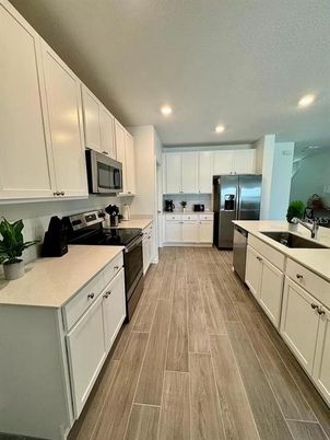 Interior, Kitchen, Recessed Lighting, Stainless Steel Appliances, Wood Texture Flooring