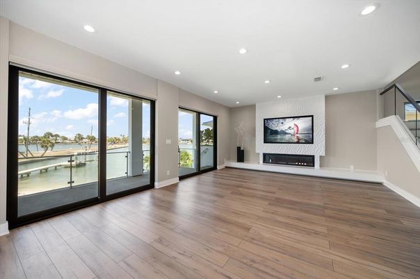 Empty room, Fireplace, Interior, Recessed Lighting, Water, Wood Texture Flooring