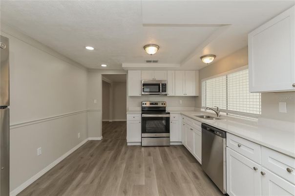 Interior, Kitchen, Recessed Lighting, Stainless Steel Appliances, Wood Texture Flooring