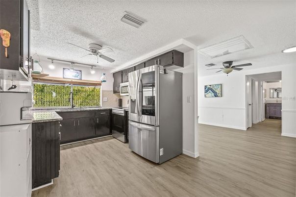 Interior, Kitchen, Recessed Lighting, Stainless Steel Appliances, Wood Texture Flooring