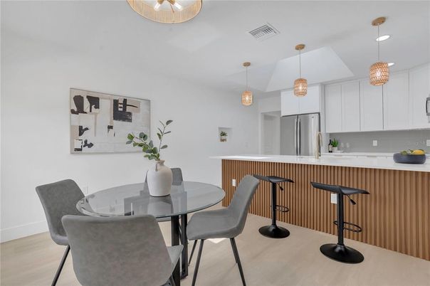 Dining room, Interior, Kitchen, Pendant Lights, Recessed Lighting, Stainless Steel Appliances, Wood Texture Flooring