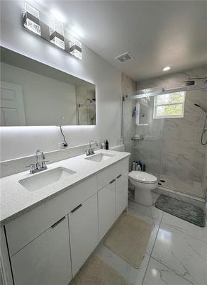 Bathroom, Dual Sink Vanities, Glass Shower, Interior, Marble, Marble Walls, Recessed Lighting