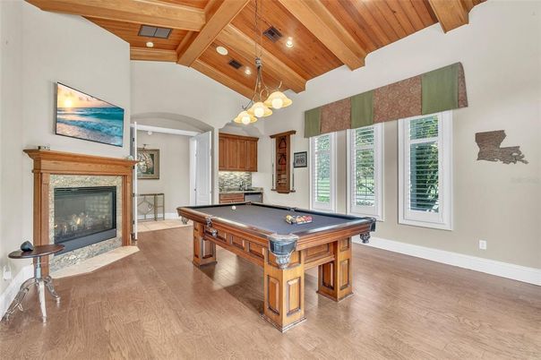 Billiard Table, Chandelier, Fireplace, Game Room, Interior, Pendant Lights, Recessed Lighting, Wooden Beams, Wooden Ceilings, Wood Texture Flooring