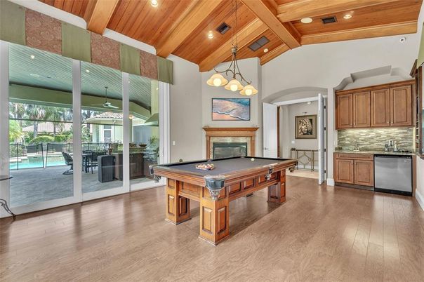 Billiard Table, Fireplace, Game Room, Interior, Pendant Lights, Recessed Lighting, Wooden Beams, Wooden Ceilings, Wood Texture Flooring
