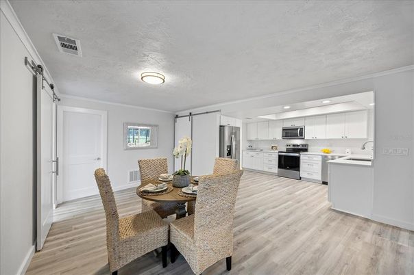 Dining room, Interior, Kitchen, Recessed Lighting, Stainless Steel Appliances, Wood Texture Flooring