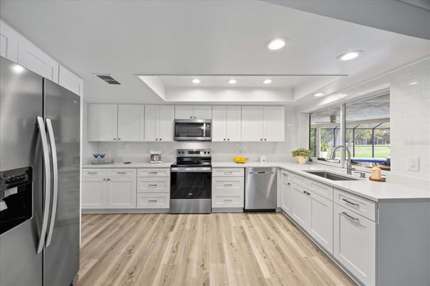 Interior, Kitchen, Recessed Lighting, Stainless Steel Appliances, Wood Texture Flooring