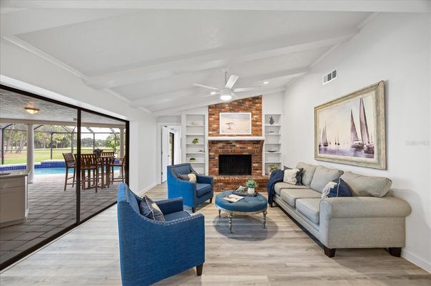 Fireplace, Interior, Living room, Recessed Lighting, Stone Walls, Wood Texture Flooring