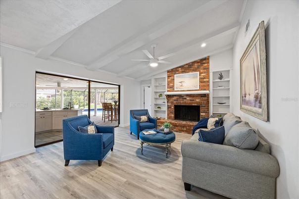 Fireplace, Interior, Living room, Recessed Lighting, Stone Walls, Wood Texture Flooring