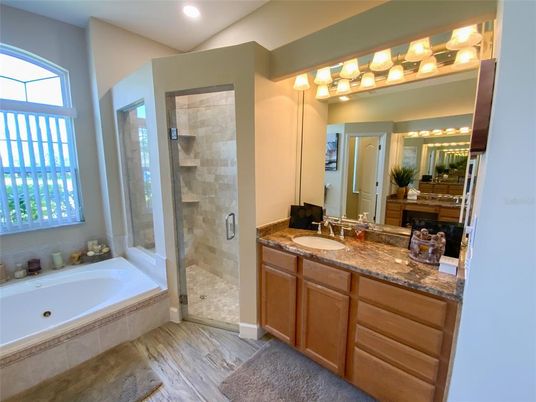 Bathroom, Dual Sink Vanities, Glass Shower, Interior, Recessed Lighting, Wood Texture Flooring