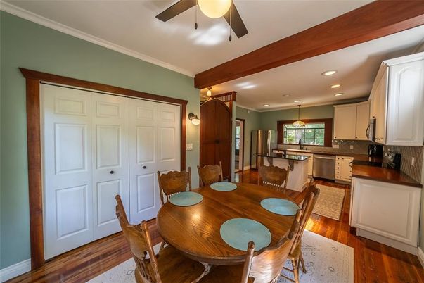 Dining room, Interior, Kitchen, Pendant Lights, Recessed Lighting, Stainless Steel Appliances, Wood Texture Flooring
