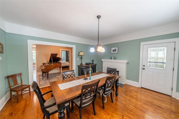 Dining room, Fireplace, Interior, Pendant Lights, Piano, Wood Texture Flooring