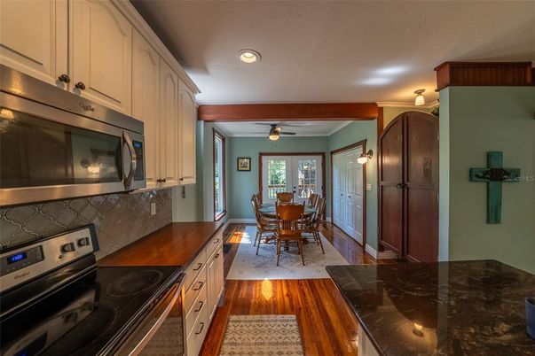 Dining room, Interior, Kitchen, Recessed Lighting, Stainless Steel Appliances, Wood Texture Flooring