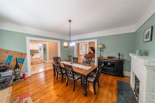 Dining room, Fireplace, Interior, Pendant Lights, Wood Texture Flooring