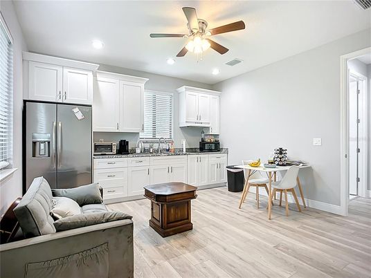 Dining room, Interior, Kitchen, Recessed Lighting, Stainless Steel Appliances, Wood Texture Flooring