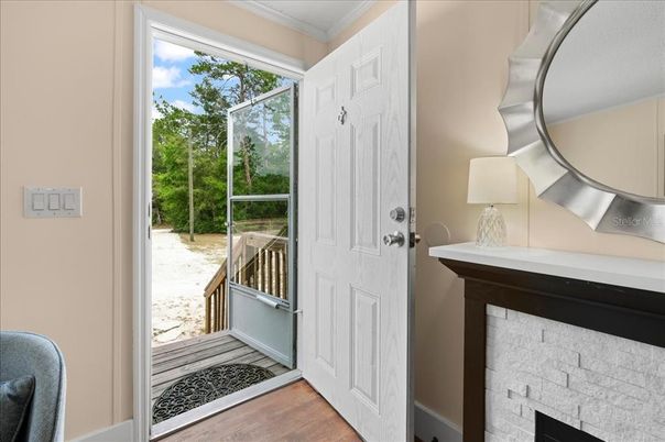 Fireplace, Interior, Sun Room, Wood Texture Flooring