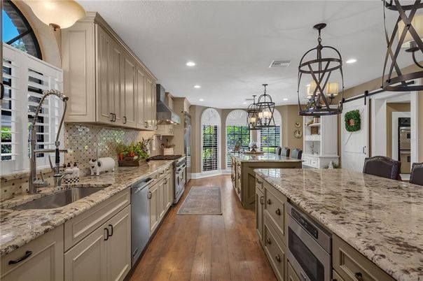Chandelier, Interior, Kitchen, Pendant Lights, Recessed Lighting, Stainless Steel Appliances, Wood Texture Flooring