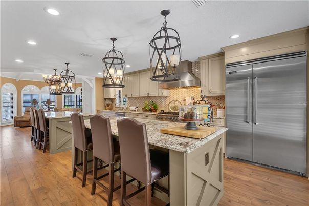 Chandelier, Dining room, Interior, Kitchen, Recessed Lighting, Stainless Steel Appliances, Wood Texture Flooring