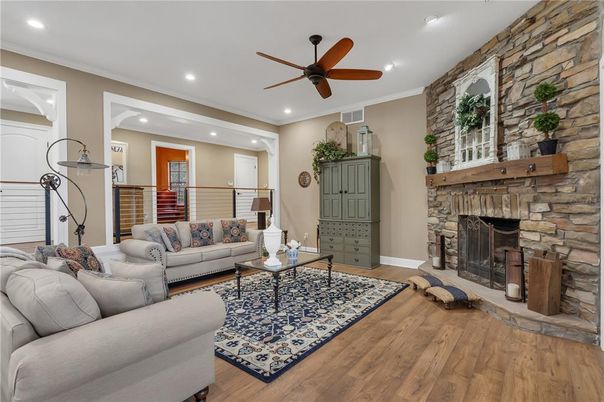 Fireplace, Interior, Living room, Recessed Lighting, Stone Walls, Wood Texture Flooring